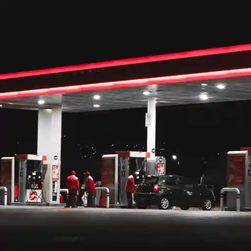 Fuel station with complete petroleum fuel system at night